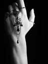 Mystic black & white female hand with gothic chain