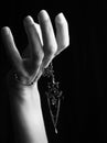 Mystic black & white female hand with gothic chain