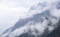 Mystic cloudy and foggy autumn alpine mountain slopes scene. Austrian Lienzer Dolomiten Alps