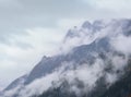 Mystic cloudy and foggy autumn alpine mountain slopes scene. Austrian Lienzer Dolomiten Alps