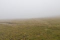 Fog over a mountain path Royalty Free Stock Photo