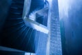 Mystic interiors, old abandoned unfinished building of Bokor Casino, empty and dark spiral staircase. Top view