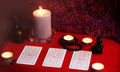 Mystic ritual with tarot cards, and candles.
