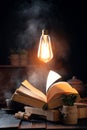 mystic still life with a magic book, steam from a book and a burning light bulb hanging in the air