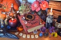 Mystic still life with witch book of magic spells, runes, candles and pentagram on wooden table Royalty Free Stock Photo