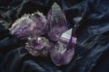 Mystical Amethyst Crystals on Dark Fabric