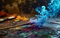 Mystical blue flame burning over colorful pigments