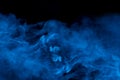 Mystical blue mist bewitching and ghostly cigarette vapor