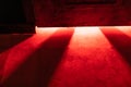 A mystical and dangerous red light through a gap under the door. Fabulous atmosphere of mysteries and horrors Royalty Free Stock Photo