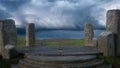 Mystical fantasy stone circle on a remote hill with storm clouds in the sky. 3D rendering