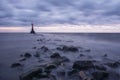 Mystical foggy sea and rocky shore in the evening