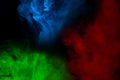 Mystical ghostly patterns of cigarette vapor red blue and green mysterious abstraction for design