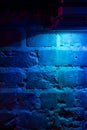 Mystical illumination of the brick wall in the old basement of the castle.