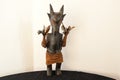 An mystical interesting African wooden sculplture with feathers in the shape of a goat