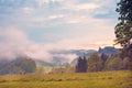 Mystical landscape with sunrise and morning fog in the mountains Royalty Free Stock Photo