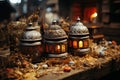 Intricately designed lanterns emitting a warm, amber glow, surrounded by dried flora and rustic elements Royalty Free Stock Photo