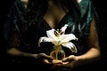 Mystical Lily in sand clock on Glowing Vial Held by Woman