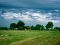 Mystical Misdwestern Storm Clouds Rolling in Over a Farm Royalty Free Stock Photo