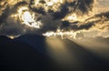 Mystical mood with sun behind dark clouds, sun rays falling over a dark mountain, Colombia Royalty Free Stock Photo