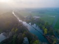 Mystical Morning: Aerial Panoramic View of River, Farm Field, and Forest Landscape in Morning Fog and Sunrise Royalty Free Stock Photo