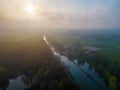 Mystical Morning: Aerial Panoramic View of River, Farm Field, and Forest Landscape in Morning Fog and Sunrise Royalty Free Stock Photo