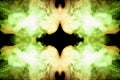 Mystical pattern of colored smoke of yellow and green in the shape of a head creating a sense of fear on a black isolated