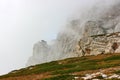 Mystical rocky cliffs wrapped in clouds or fog. Royalty Free Stock Photo