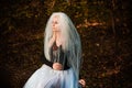 Halloween time, girl in white veil at forest Royalty Free Stock Photo