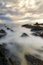 mystical sunrise moment near the sea shore with cloudy sky