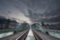 Mystical train bridge made of steel and dramatic s Royalty Free Stock Photo