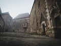 Interior and exterior of the Hunedoara castle in Romania in foggy conditions Royalty Free Stock Photo