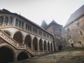 Interior and exterior of the Hunedoara castle in Romania in foggy conditions Royalty Free Stock Photo