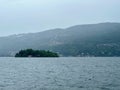 Mystical View of Isola Madre Surrounded by the Waters of Lake Maggiore, with Misty Hills of Verbania in the Background Royalty Free Stock Photo