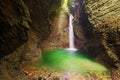 Mystical view of the rocky amphitheatre with a green pool and a white beam of water. 15-metre-high Kozjak Waterfall