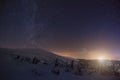 Mystical view of snowy hills in mountain valley