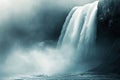 Mystical waterfall cascading down rugged cliffs surrounded by mist and spray Royalty Free Stock Photo