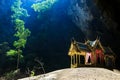 Mystique view to the Phraya Nakhon Cave with the Khuha Kharuehat Pavilion illuminated by Sun through the Hole in the Rocky Top