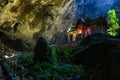 Mystique view to the Phraya Nakhon Cave with the Khuha Kharuehat Pavilion illuminated by Sun through the Hole in the Rocky Top