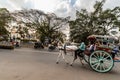 A horse cart with passengers riding through the streets in the city of Mysore Royalty Free Stock Photo