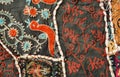 Mythical birds and unusual patterns on traditional Indian patchwork handmade carpet. Royalty Free Stock Photo