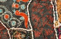 Mythical birds and unusual patterns on traditional Indian patchwork handmade carpet.