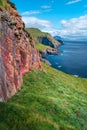 Mythical Faroe Islands in the middle of Atlantic Ocean with a lot of puffins, parrot like seabirds, summer, blue sky