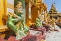 Mythological demon statue at Shwedagon Paya, the most sacred golden buddhist pagoda in Yangon, Myanmar