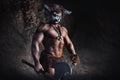 Mythological Minotaur  half bull half man stands in a rock cave in an aggressive stance Royalty Free Stock Photo