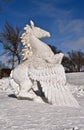 A mythological pegasus is carved from a block of ice