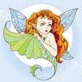 Mythological Pixie or Forest Fairy with long red hair and wings on the blue background. The series of mythological creatures