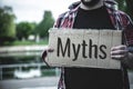 Myths word on torn papper. Myths concept.