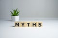 Myths word on wooden cubes. Myths concept Royalty Free Stock Photo