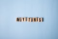 Myths word on wooden cubes. Myths concept on blue Royalty Free Stock Photo