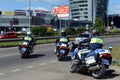 Inspectors of traffic police on motorcycles go on patrolling roads.